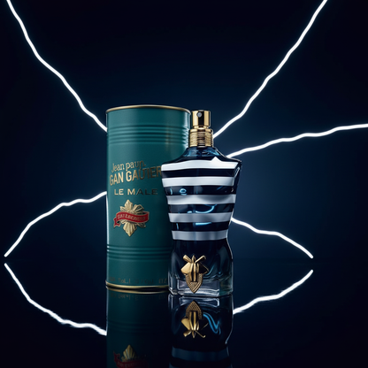 Jean Paul Gaultier Le Male perfume bottle with dramatic navy blue backgroJean Paul Gaultier Le Male Eau de Toiletteund and white light streaks